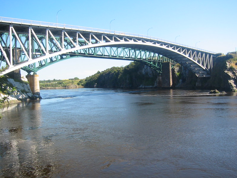 A photograph of a bridge over a river, by Natasha Hartano